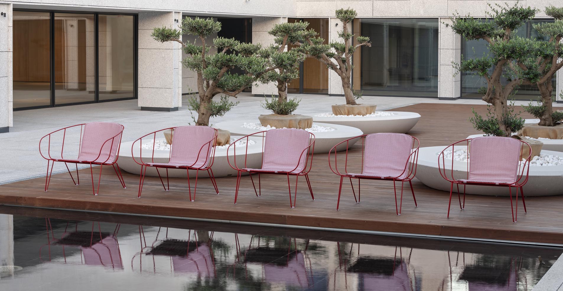 Olivo Lounge for Isimar is a stacking outdoor lounge chair