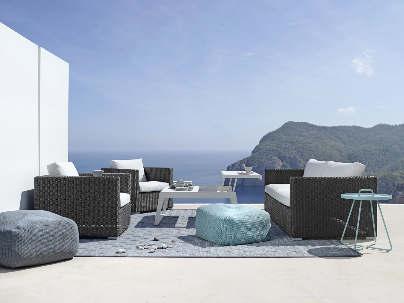 Cane-line Chester Armchair and Chester Sofa with Outdoor pouf