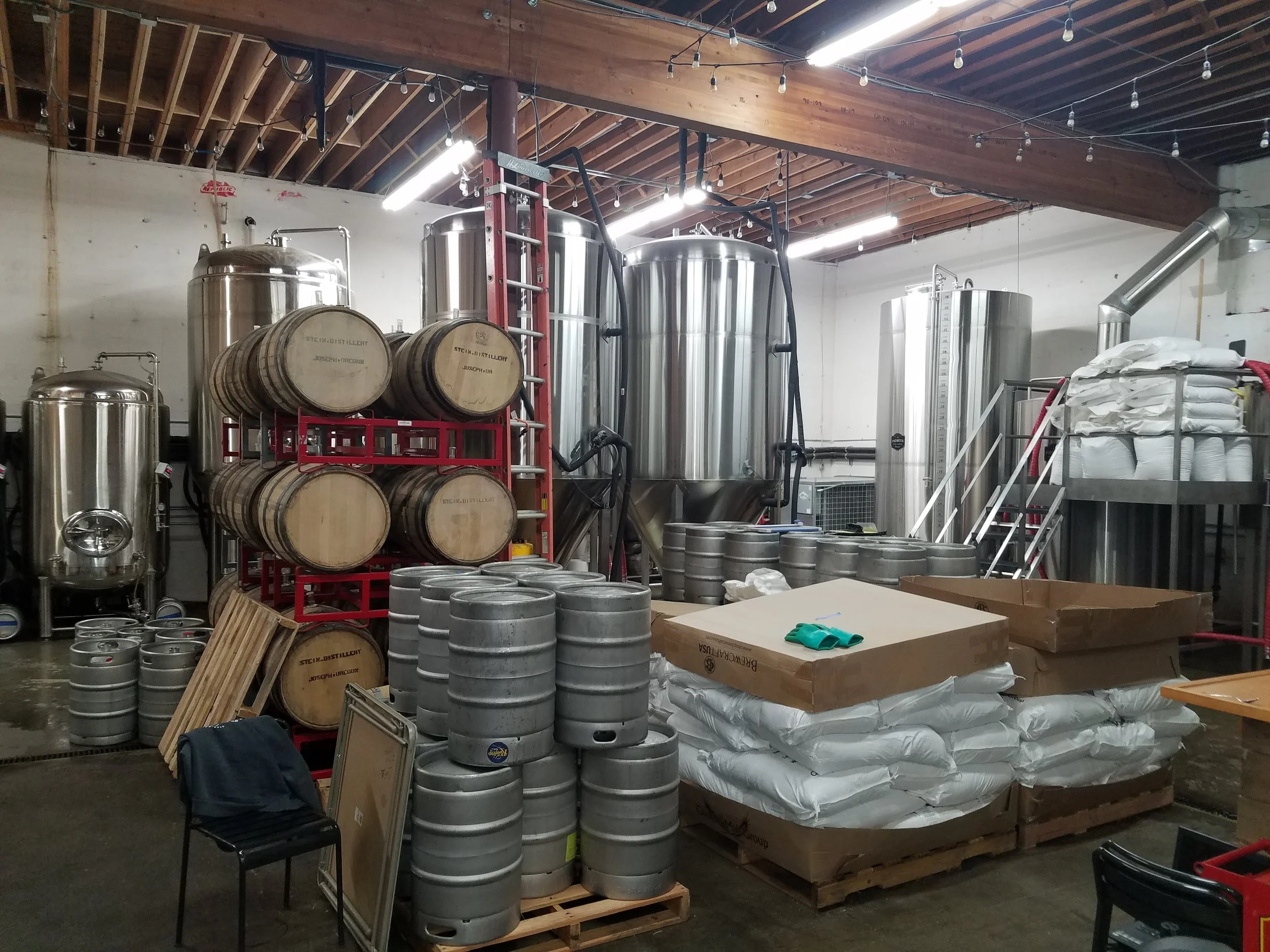 I can't really imagine the room for events down here, but Craig says it cleans up nicely! There's the 15 bbl kettle off to the right and all their 30 bbl ferms in the back behind the barrels.