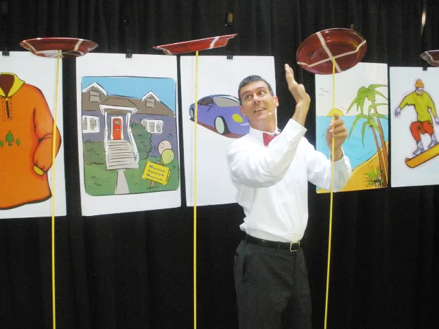 Plate spinning and comedy get kids excited as they learn about balancing needs and wants.