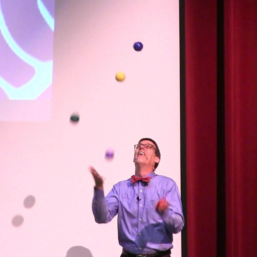 Juggling five beanbags to visually demonstrate how attention affects memory.