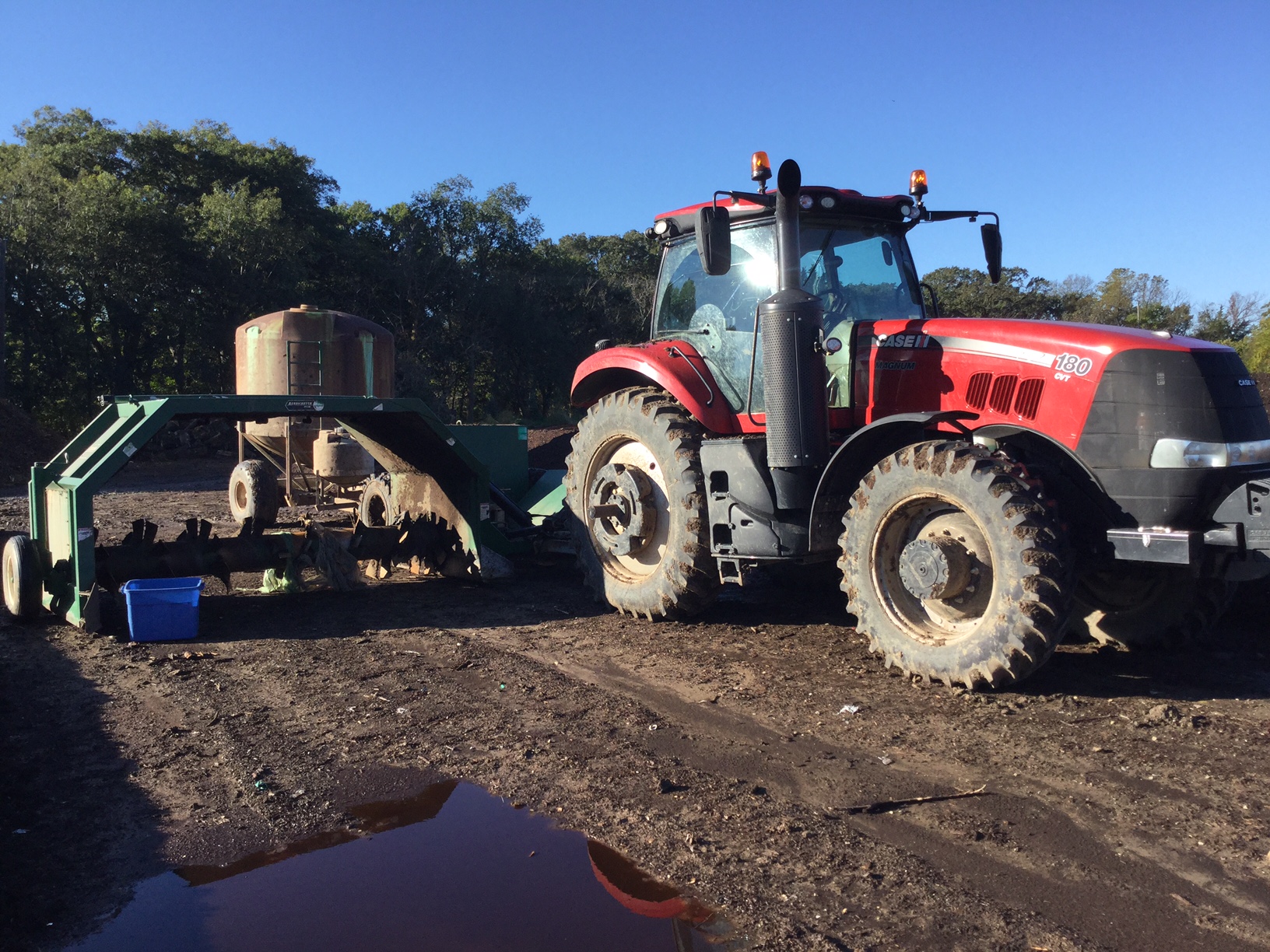 Tractor, Turner, and Water Wagon. This lets us turn about 300 yards of compost in just a few minutes. The water wagon holds 1700 gallons of water that spray from nozzles just above the turner blades so that the compost is evenly moistened when necessary..