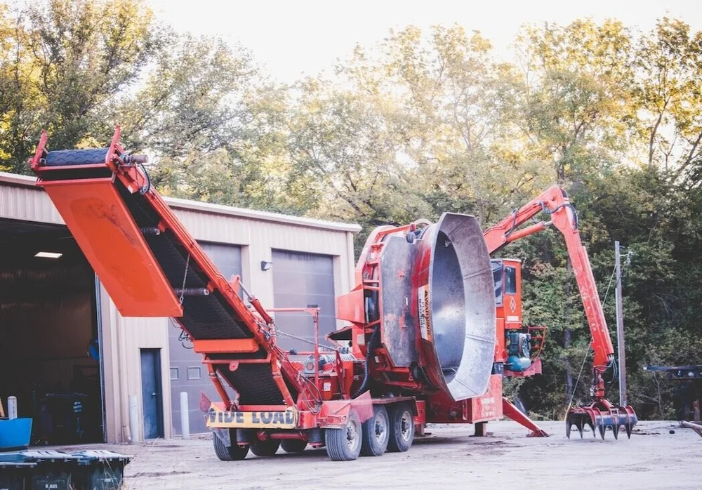 Soil Dynamics tub grinder grinding trees on site
