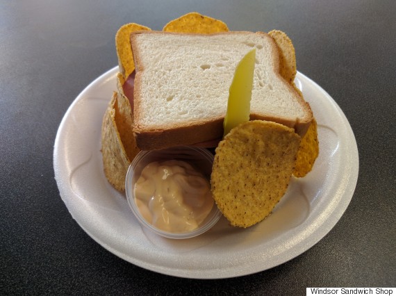 White bread, full of bologna, Russian dressing, a little pickle, and surrounded by a wall of Mexican chips 👌