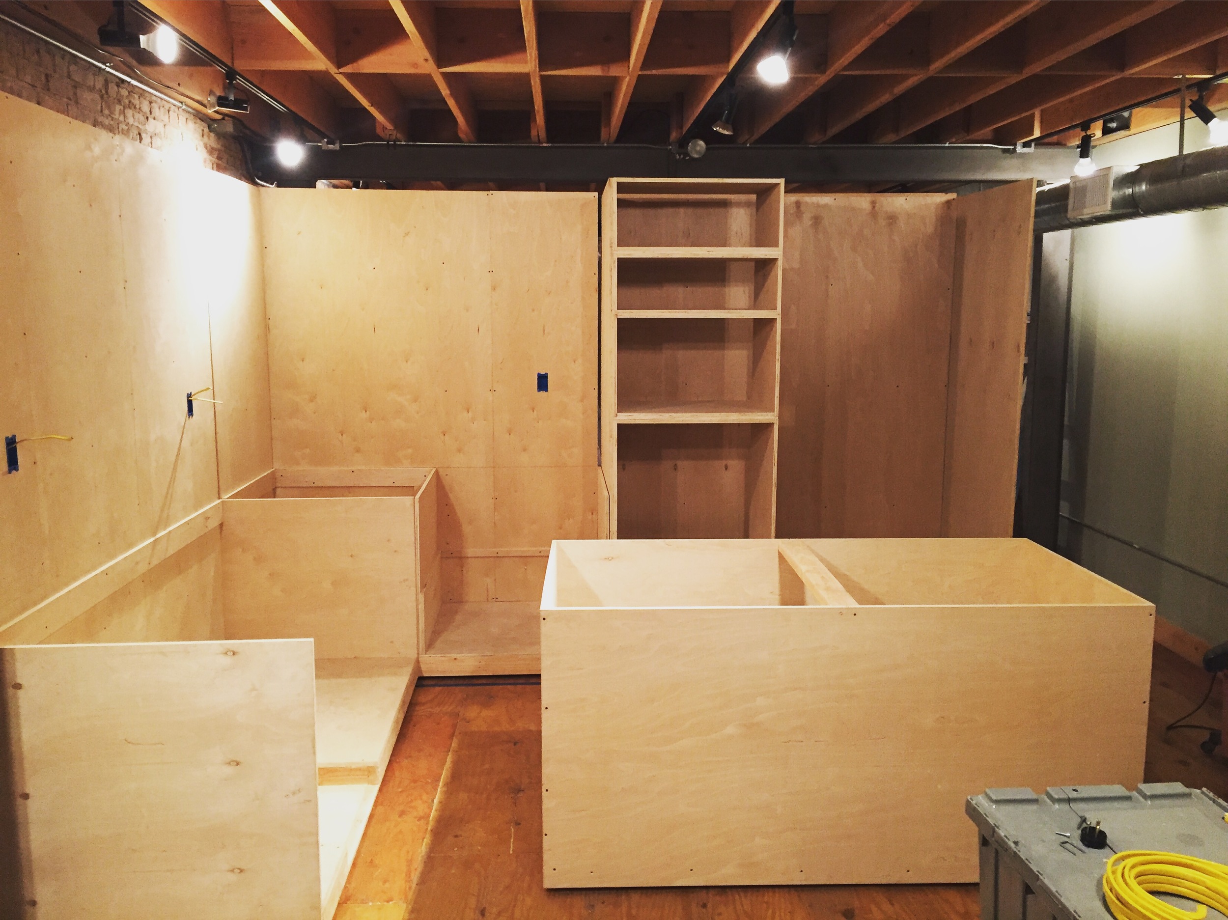 Day two & three: 3/4' birch paneling applied, electrical run, kitchen island assembled, everything ready for the maple tops.