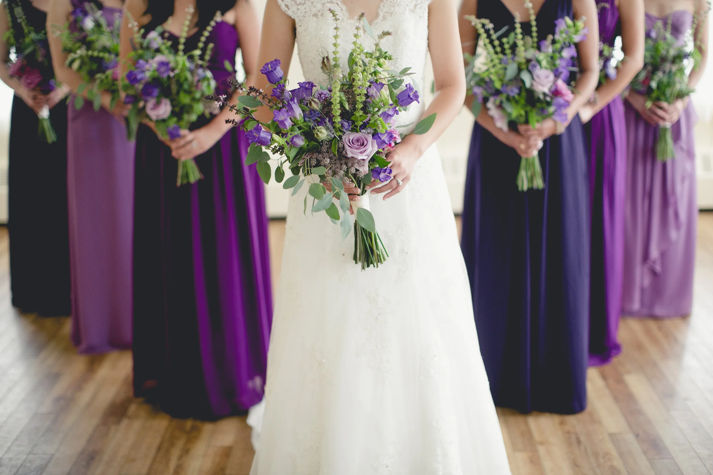 Purple ombre wedding with roses, campanula and basil
