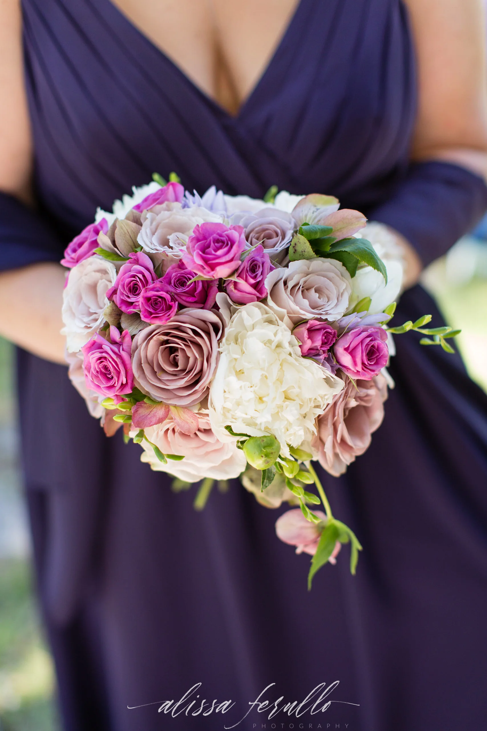 Captured by Alissa Ferullo Photography Rose and peony bouquet in purples for a Wyoming destination wedding.
