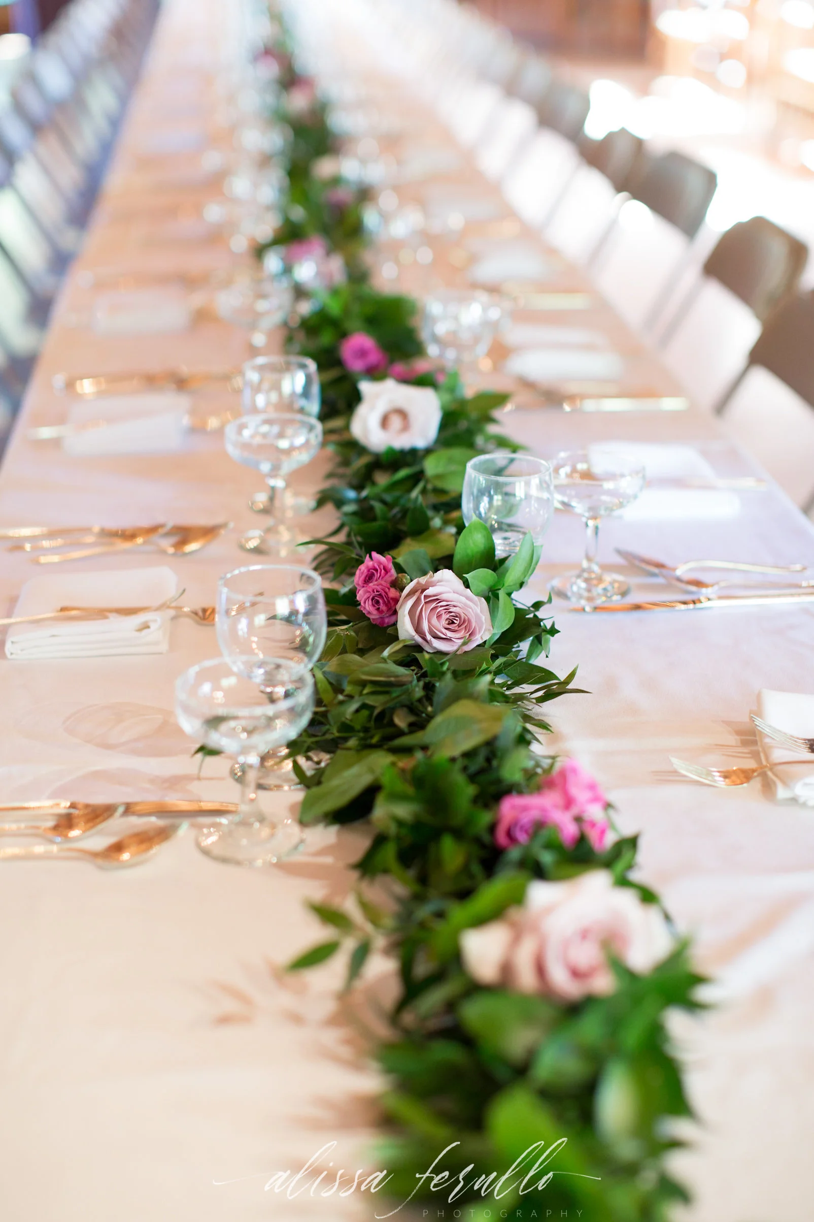 Captured by Alissa Ferullo Photography Rose studded garland for a Wyoming destination wedding.