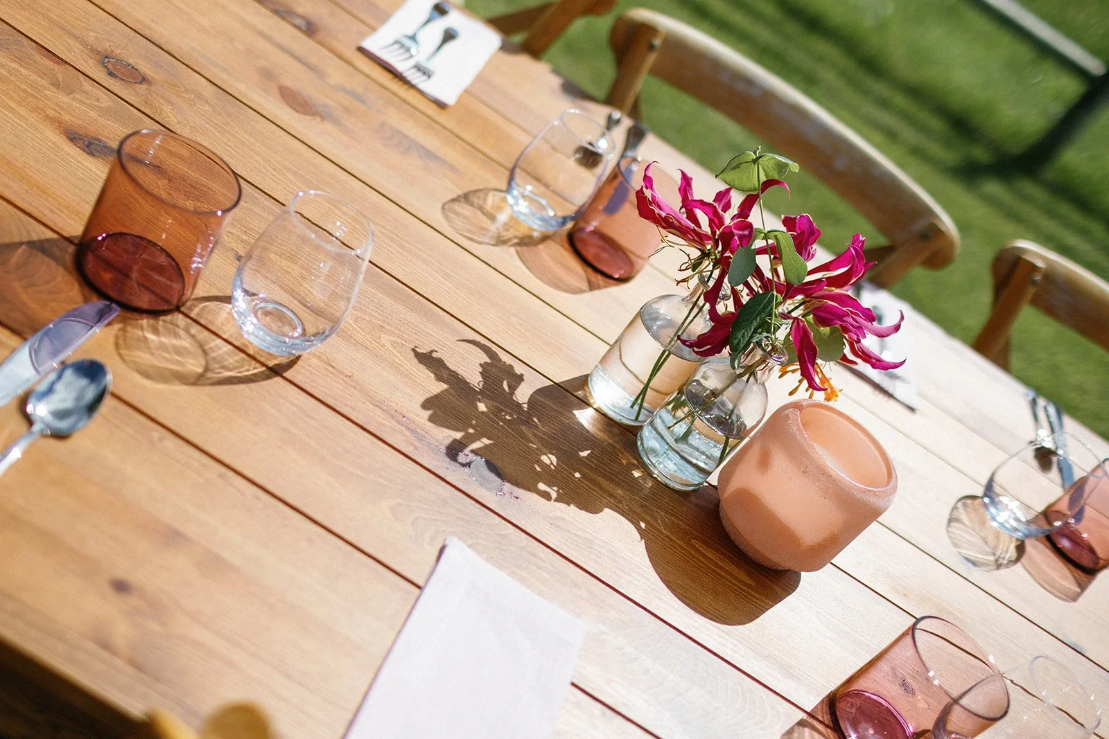 Gloriosa lily in a clear bud vase for a june wedding reception