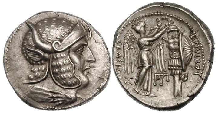 A coin minted after 301 BCE which appears to show Alexander with features associated with Dionysus , such as a panther-skin helmet and the horns and ears of a bull. 