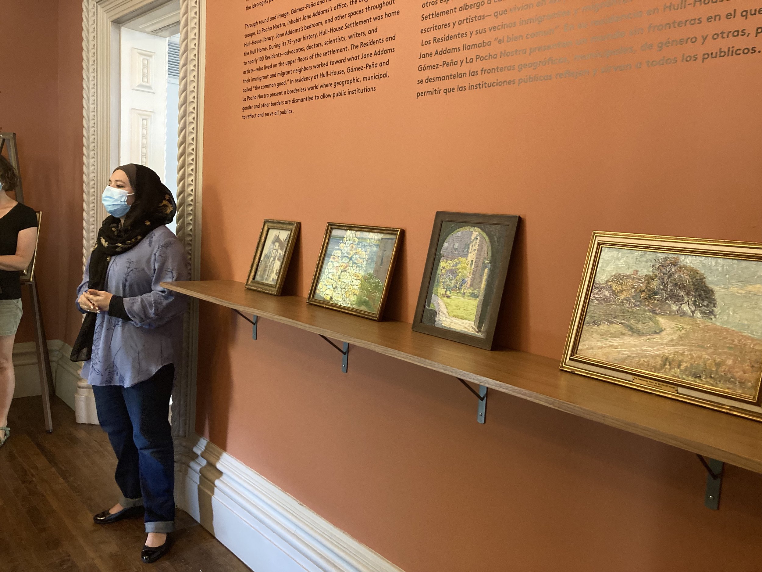 Hull-House educator Nadia Maragha presenting on paintings by Enella Benedict