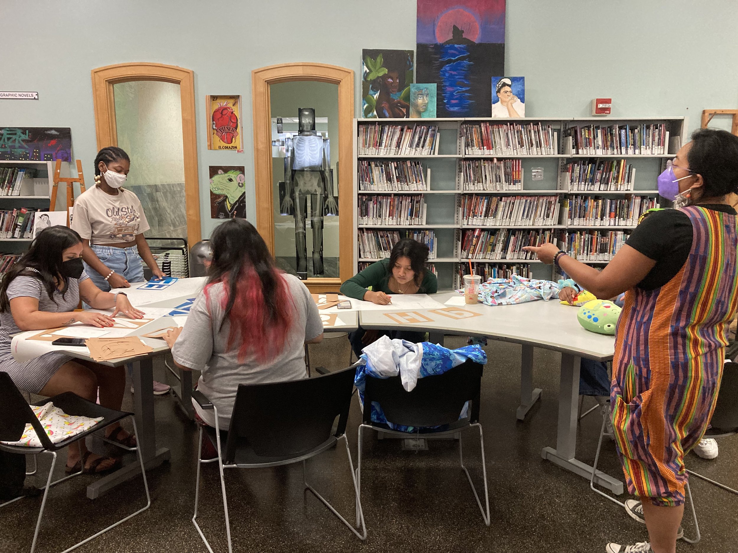  On  July 21st, 12-4pm,  The YOUMedia Space hosted a Protest Banner Making Workshop. In this free workshop, teens learned about the process of how to make a banner with artist-educator Moki Tantoco and created banners either for their own usage or fo