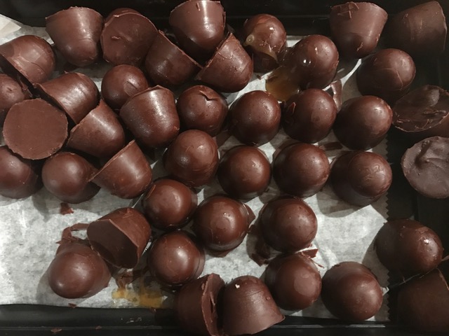 These are just missing gold foil wrappers or some edible gold dust!