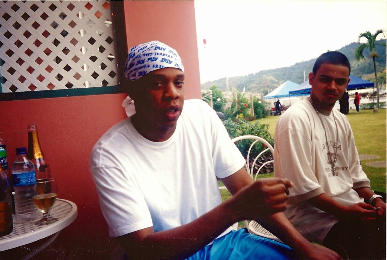 aintnojigga:
Jay-Z and his personal barber Johnny Cake on the set of Big Pimpin’ in Trinidad in 2000. Since Dame Dash set the two up in 1997 no one else has cut Hov’s hair. Photograph taken by Calvin ”Klein“ Bacote, one of Hov’s closest busin…