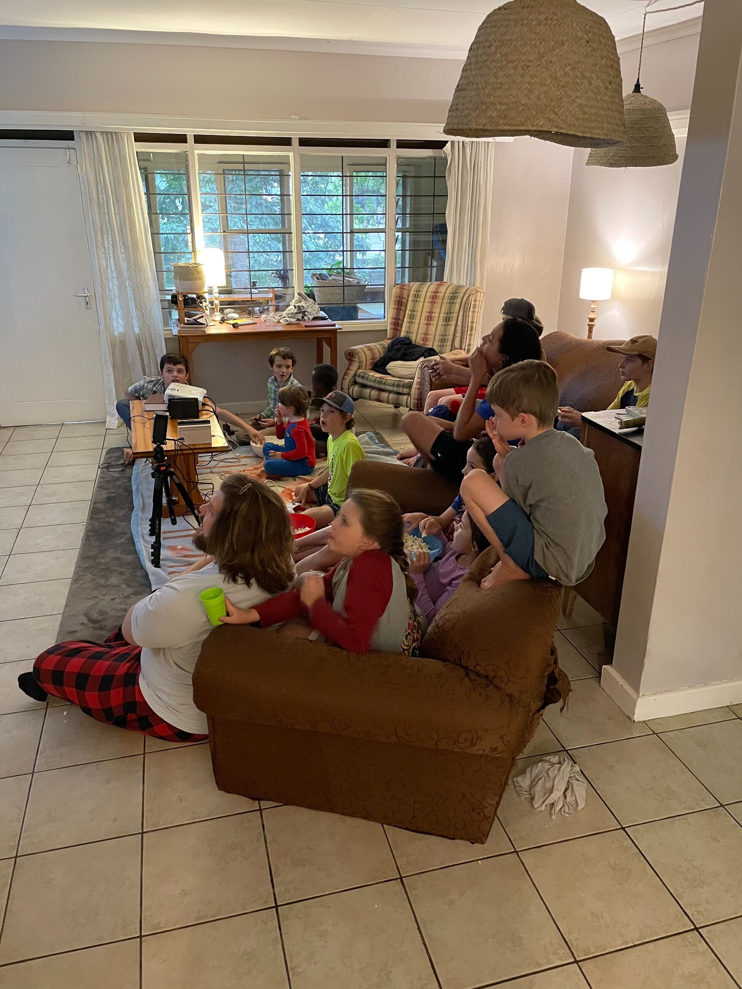  16 kids and 7 adults, 2 Switch’s, 2 projectors, 5 bowls of popcorn, 1 cake, and 16,000,000 decibels. 