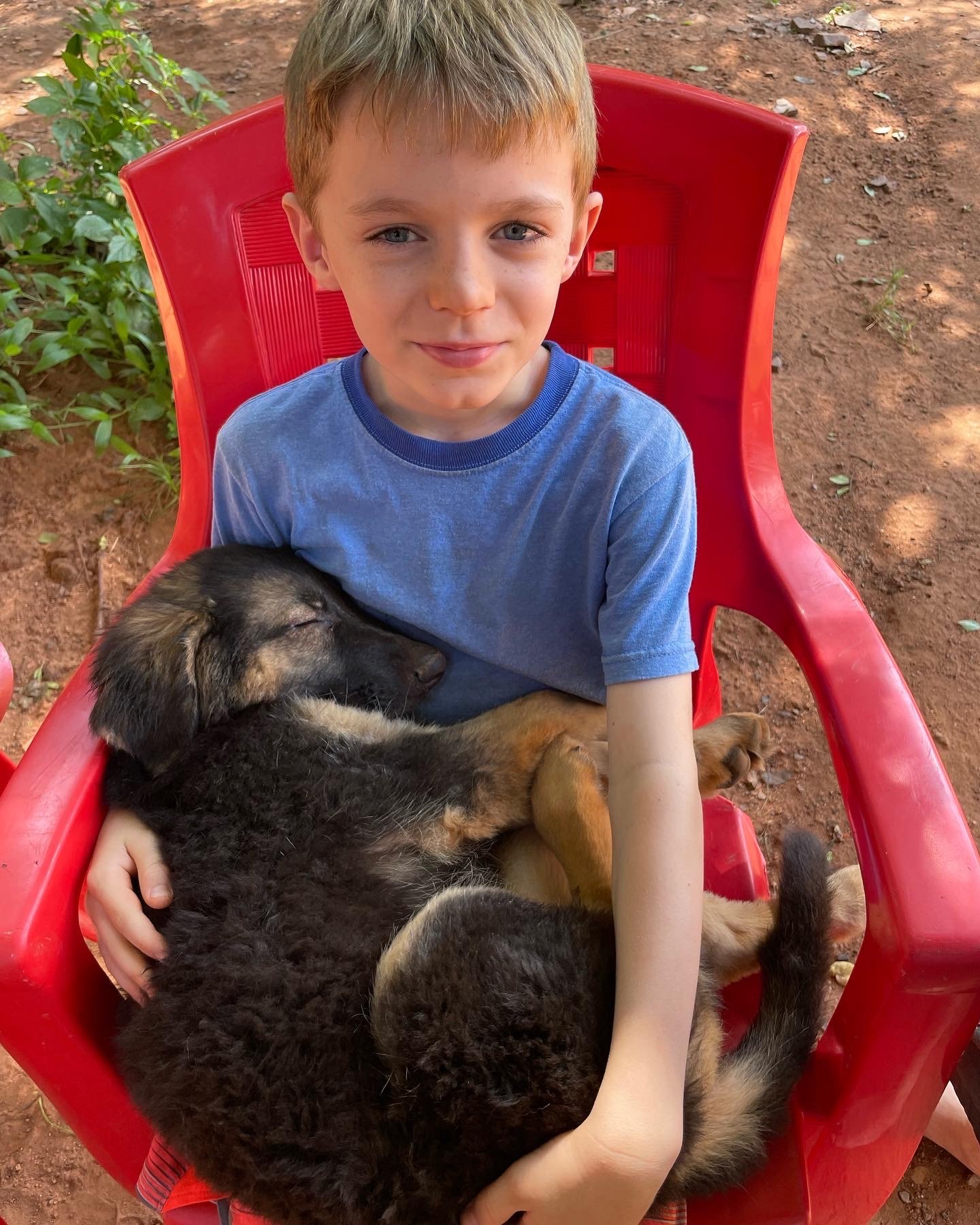 Luke sitting with the new pup.
