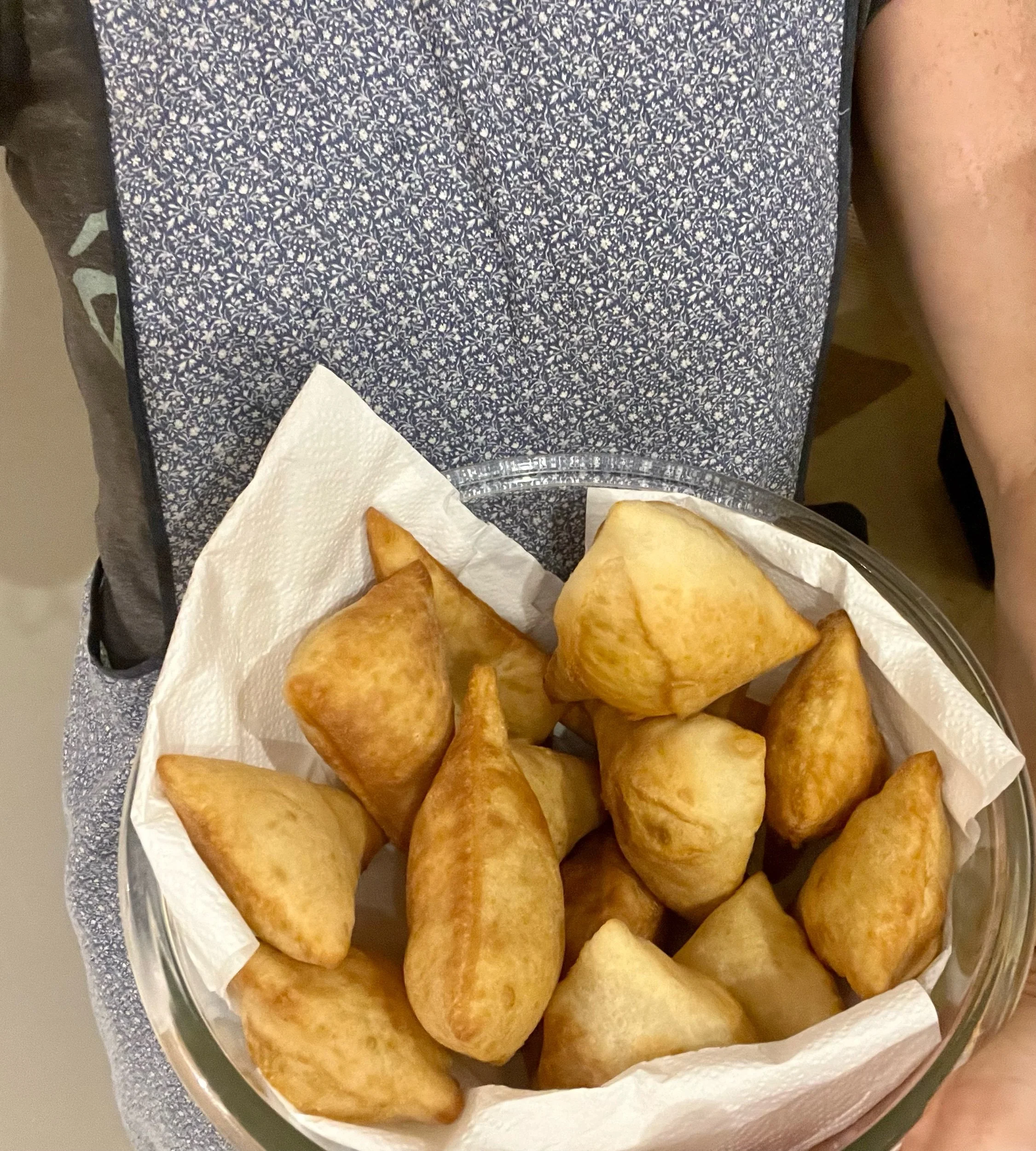 Baking her mom's favorite while wearing her mom's apron.