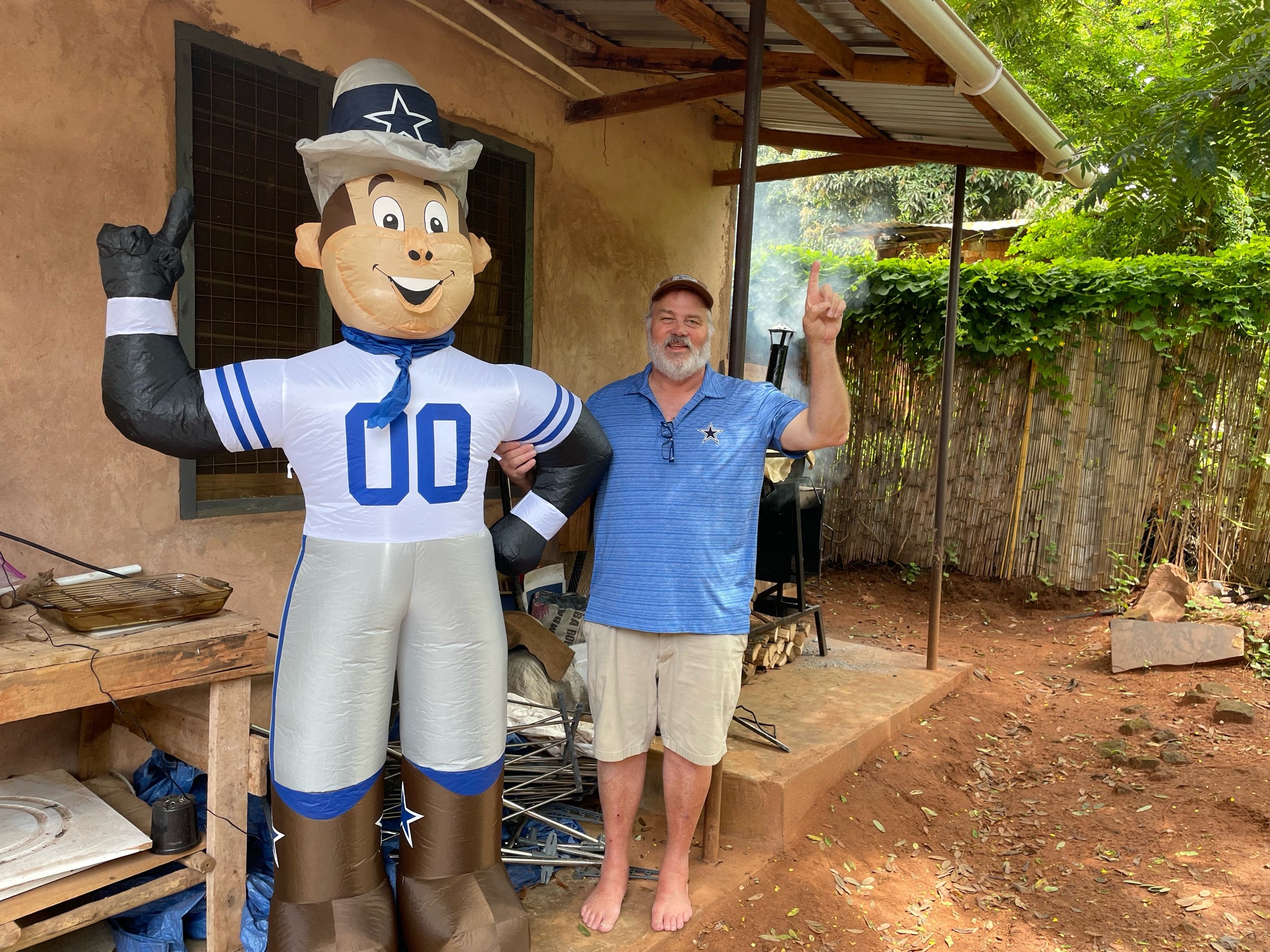 Don and Rowdy cheering his team on Thanksgiving