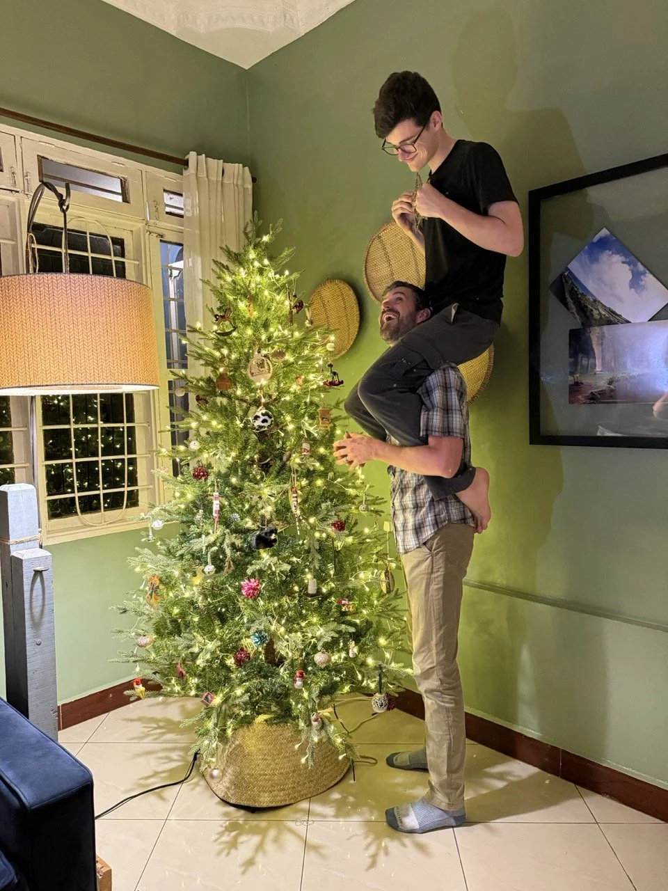 Boosting my boy to put on the star.