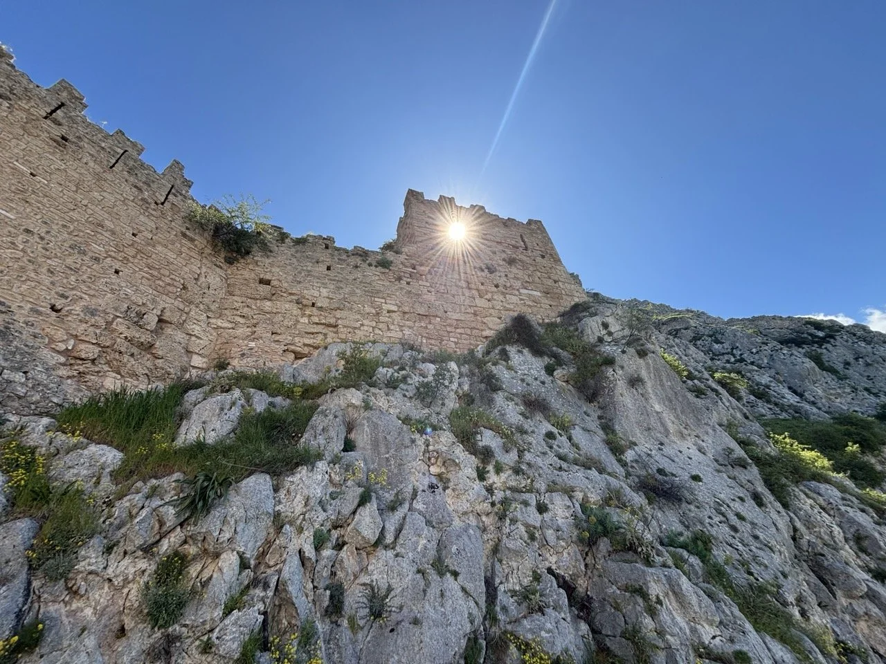 Sun peeking at Acrocorinth