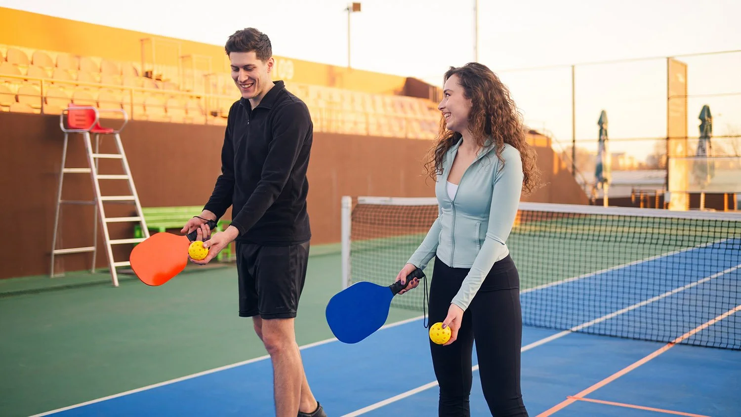 Active adults playing pickleball with proper form to avoid common injuries