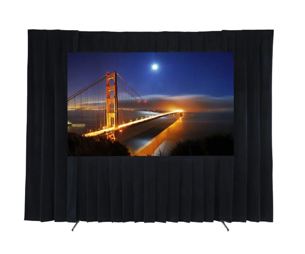 A stage with a large screen displaying a night scene of the Golden Gate Bridge illuminated, with a bright moon in the sky and city lights in the background.