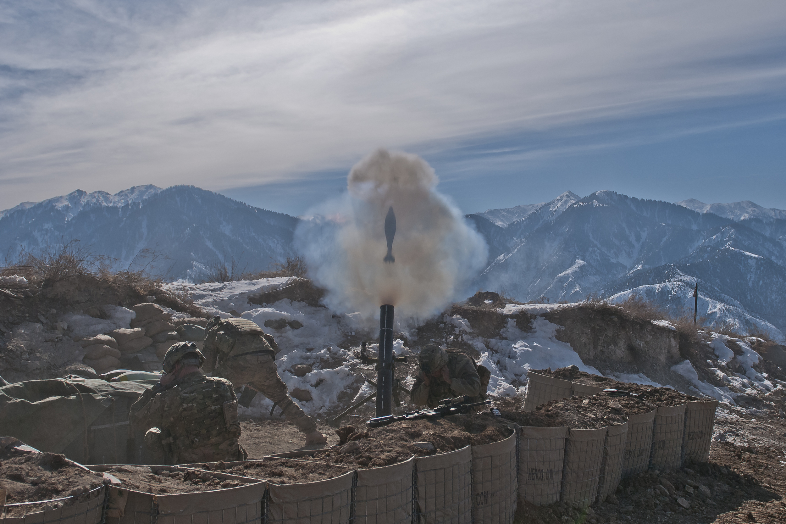  KUNAR PROVINCE, Afghanistan – A 120mm mortar round flies out of the tube as U.S. Army Staff Sgt. Ramey J. Brown (left), a section sergeant from Marshville, N.C., Spc. Tyler L. Dillon (center), a team leader from Williamstown, W. Va., and Pvt. Gabrie