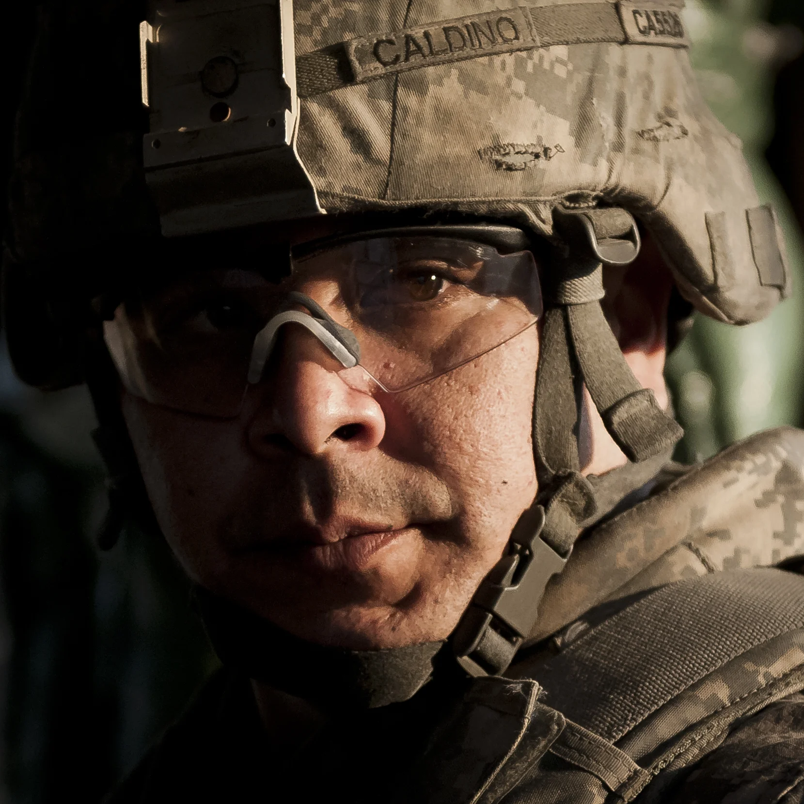  NANGARHAR PROVINCE, Afghanistan – During a quiet moment overlooking farmers in their fields, U.S. Army Spc. Damian C. Caldino, a food service specialist from Oxnard, Calif., assigned to Forward Support Company G, 2nd Battalion, 320th Field Artillery