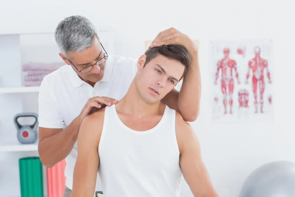 bigstock-Doctor-doing-neck-adjustment-i-85571075.jpg
