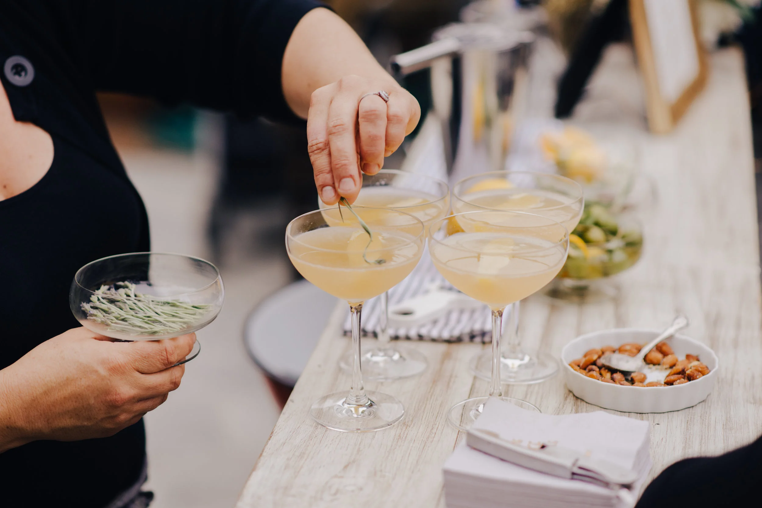 garnishing drinks with lavender grown at our farm. photo by Evynn LeValley .