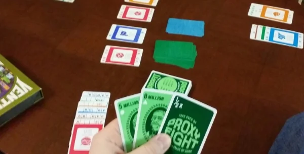 Sorry about the blurriness. Attempting to show the Profit card revealed in the discard pile after being drawn! I wasn't very clear on how scoring worked (aside from the number of Corporation cards in your Conglomerate — if you can see I have all 6 types in mine!). I just sat there and scored big money with my single Conglomerate, winning the game at the end!