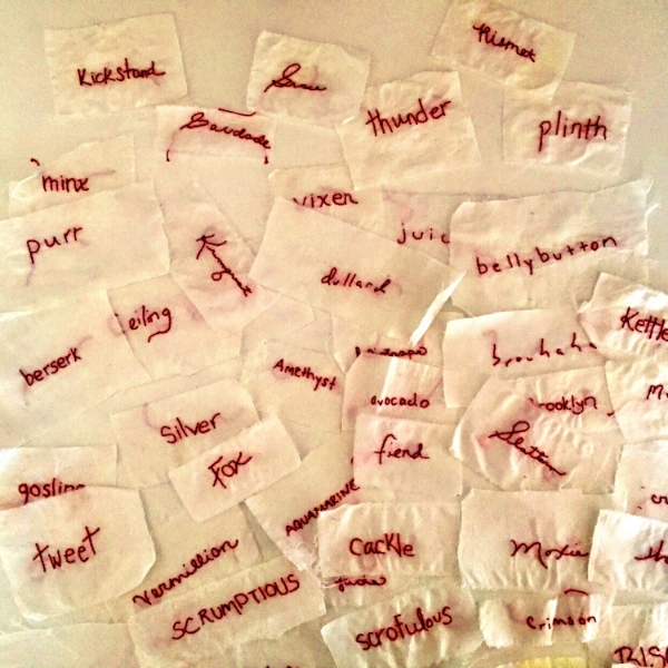 Stitched, redwork words. I'm trying to incorporate these into a metal piece, but so far nothing has worked.