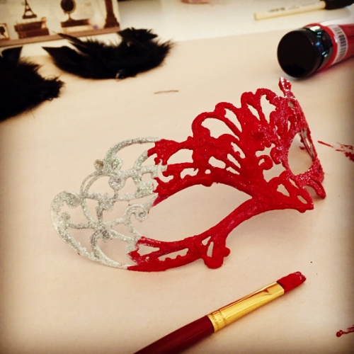 Glittery mask painting.