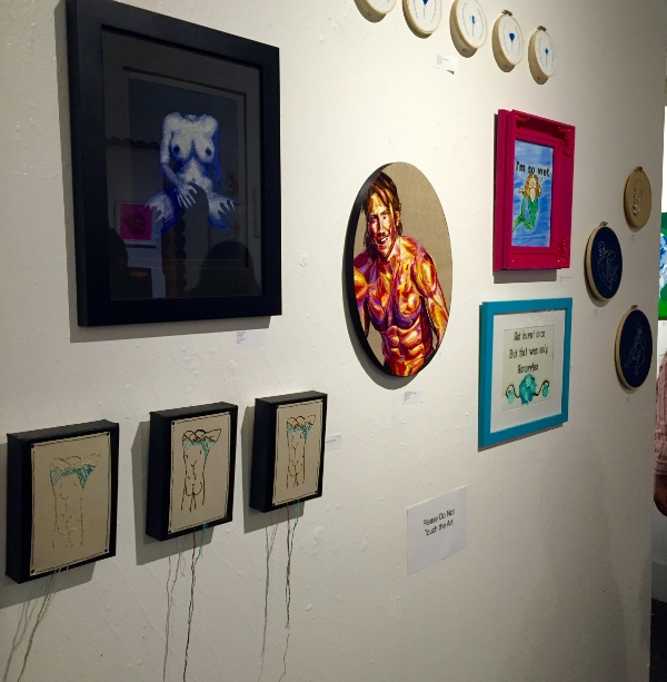 Gallery wall, including work by Julie Sarloutte, Pete Seazle and others.