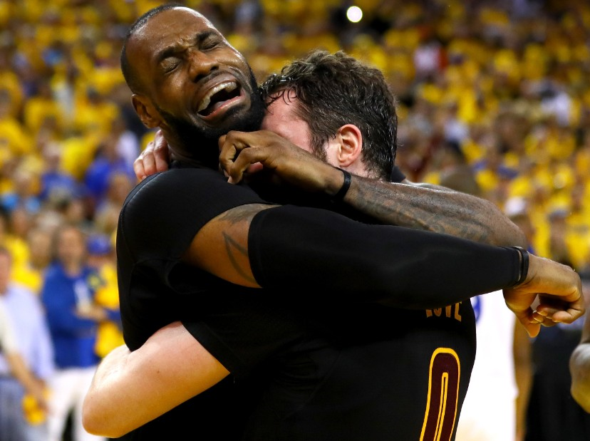 LeBron gives Kevin Love a huge hug after the win. "Thanks man for letting me convince you to be on my team."