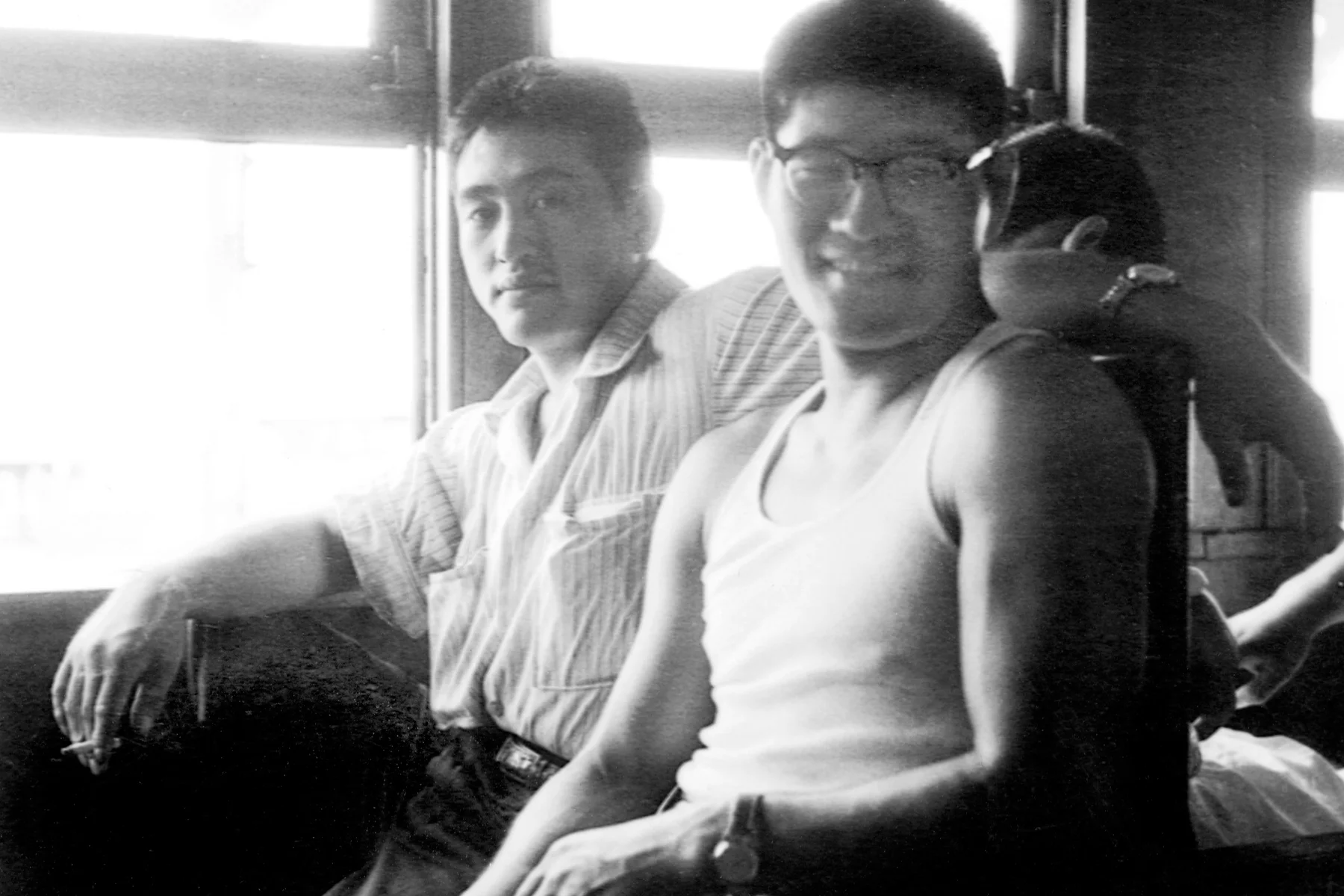 Akinori Hosaka (left) and Yoshisada Yonezuka, on a train travelling to a Judo competition, c.1960