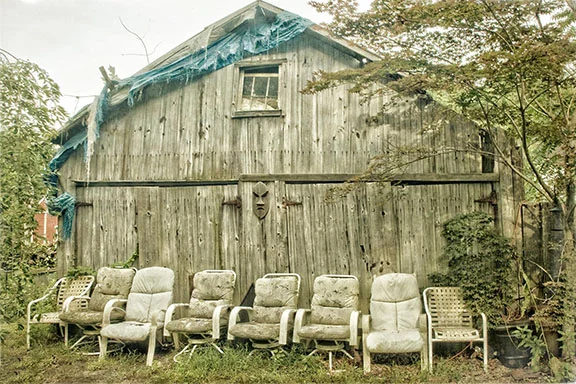   Eight Chairs by an Old Barn   Eric Rennie 