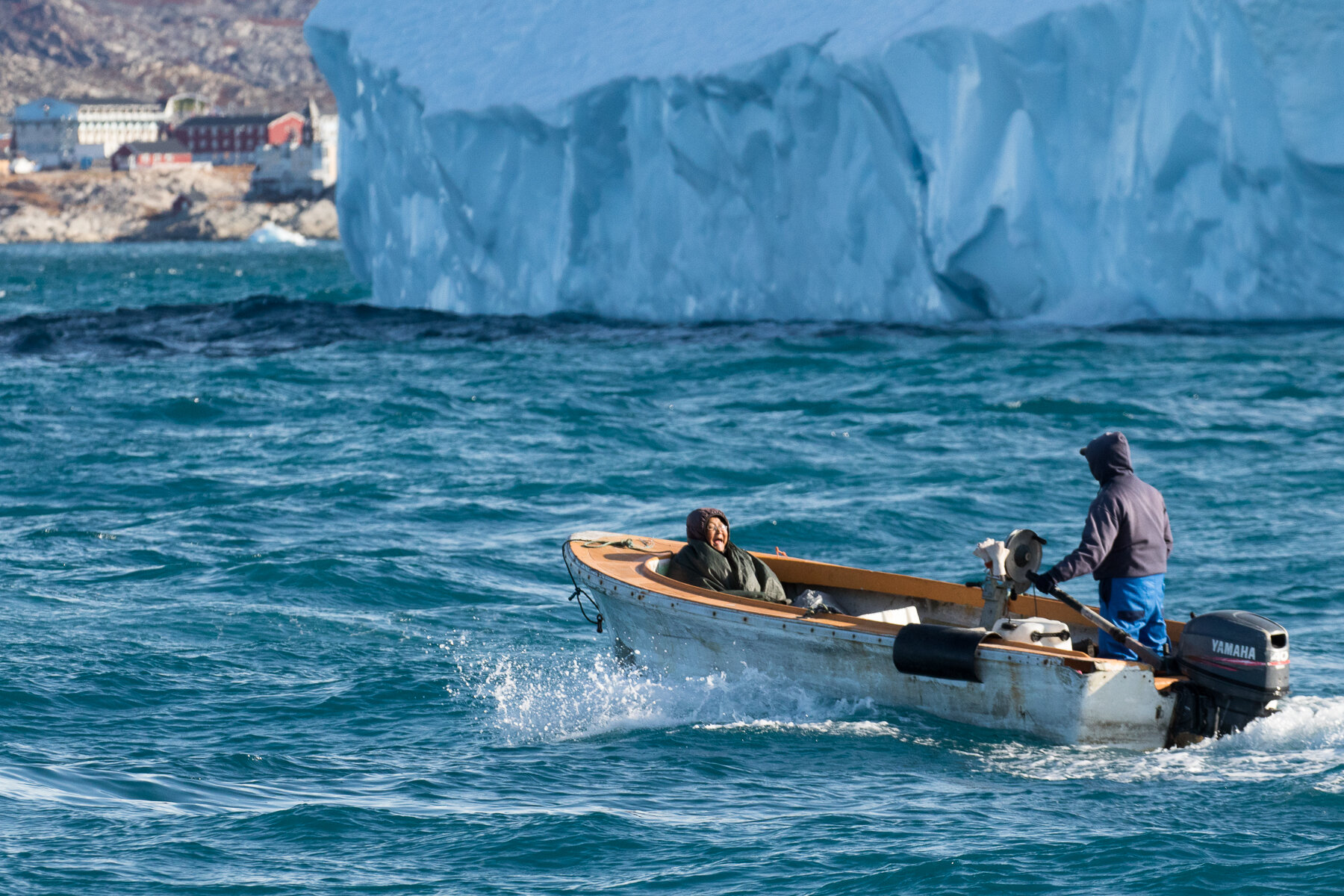  Greenland - Ilulissat- A woman laughing with pain and joy as the boat bounced relentlessly 