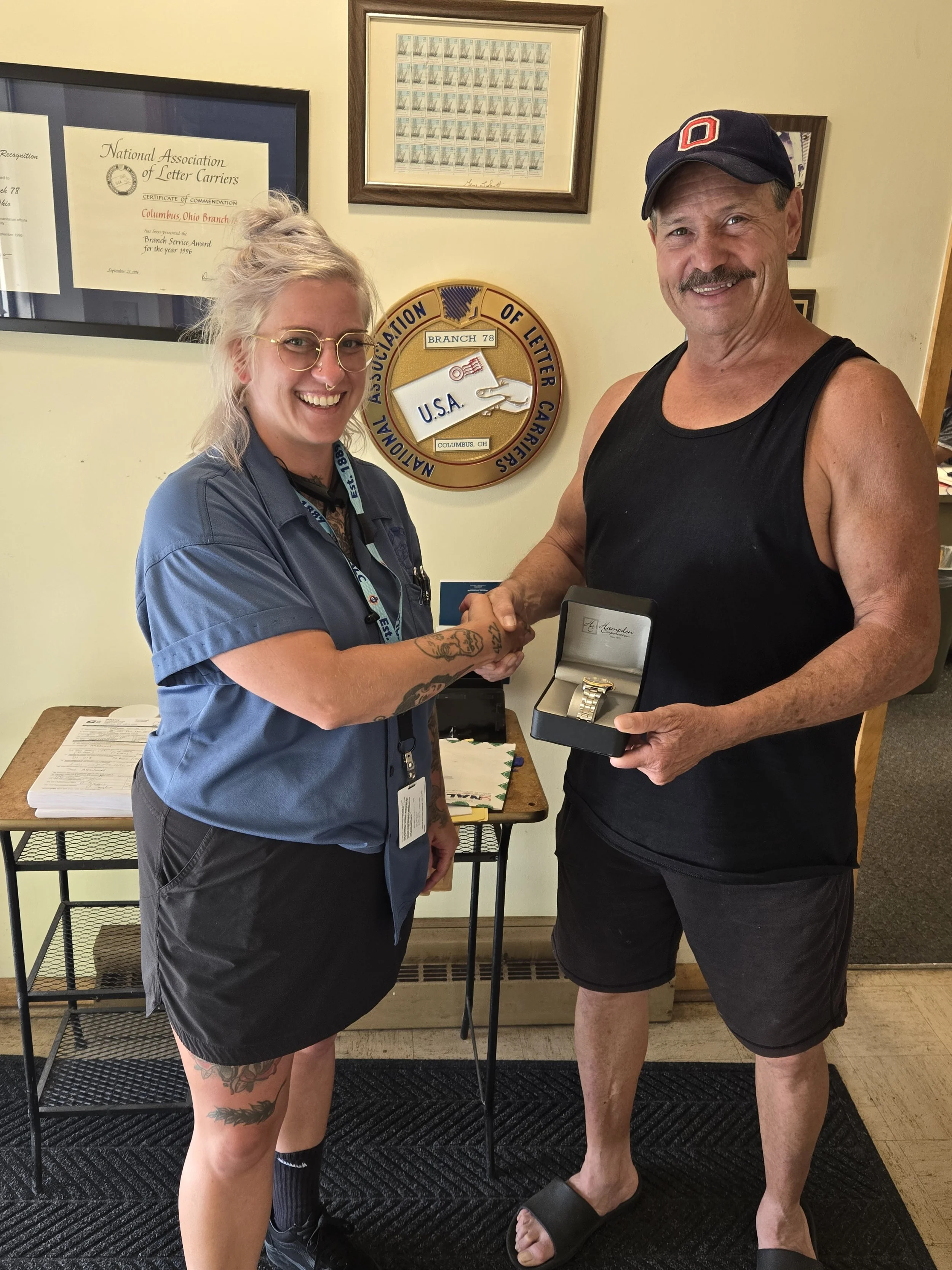Westland steward Kelsey Crosbie presents Darryl Taylor his retirement watch.jpg