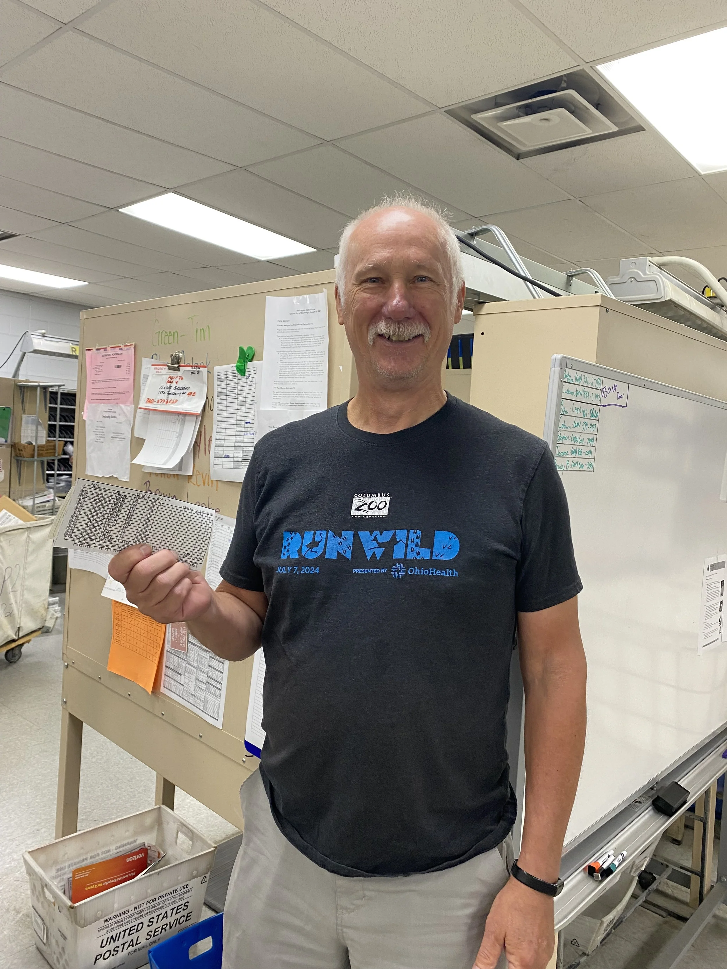 Kevin Miller retiree pickerington picking up backpay check.jpg