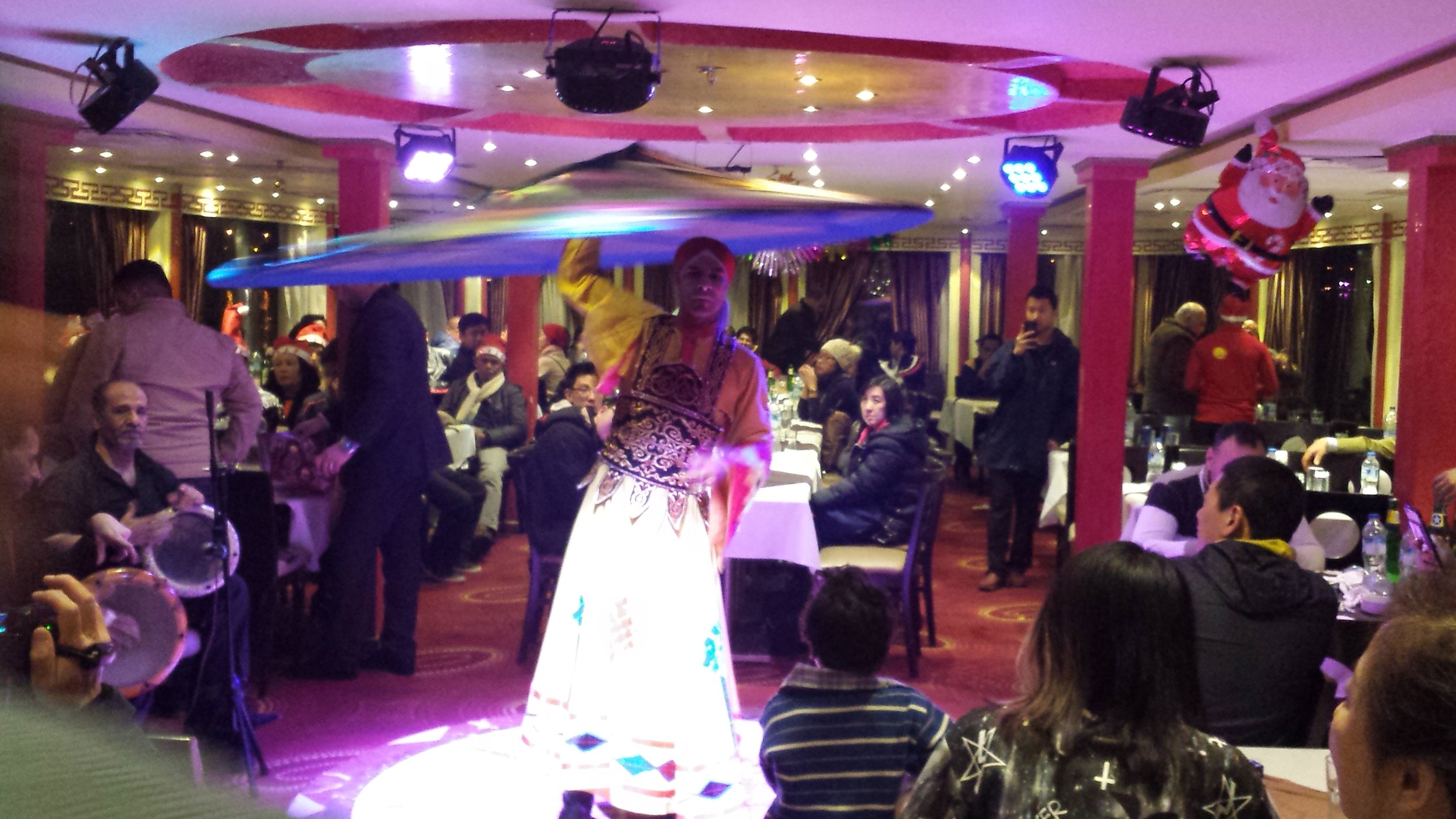 The tanoura dancer spinning his skirt like he was busting out pizzas.