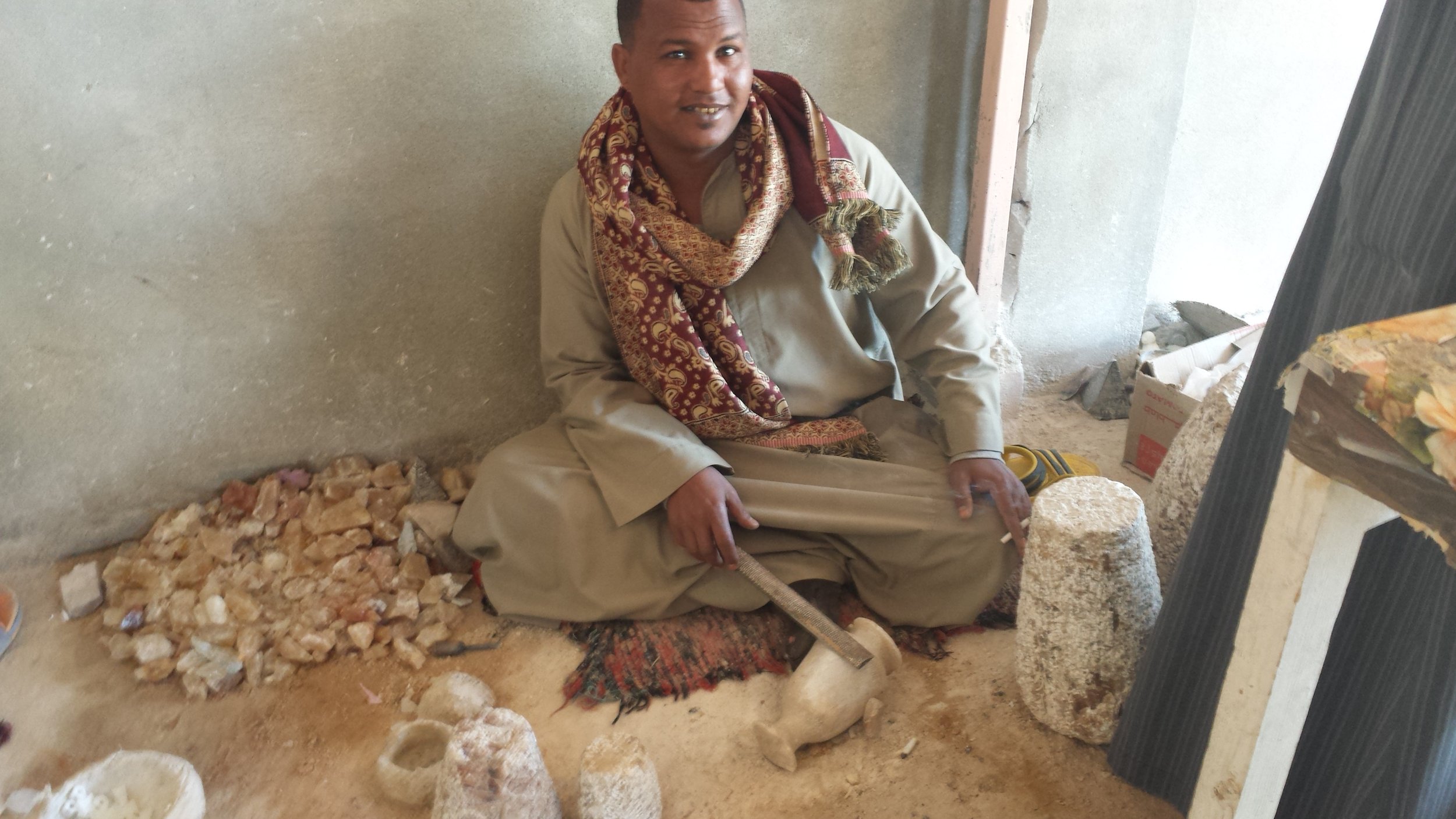 This dude's job is just to look like he's polishing the alabaster while posing for pictures.