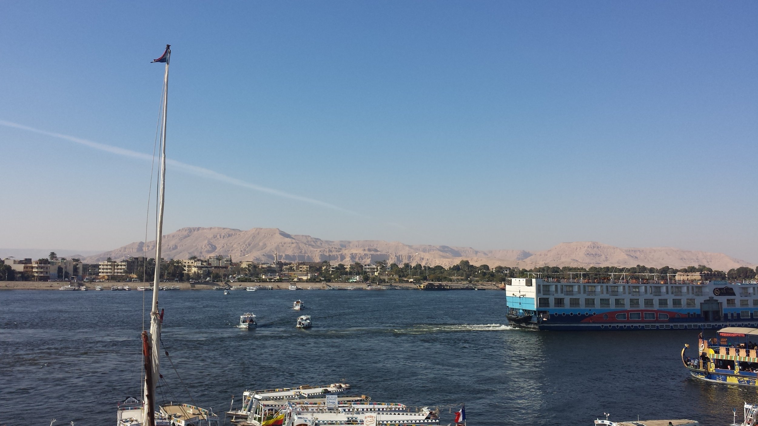 A view of Luxor's west bank from across the Nile. Those hills are where all the tombs are.