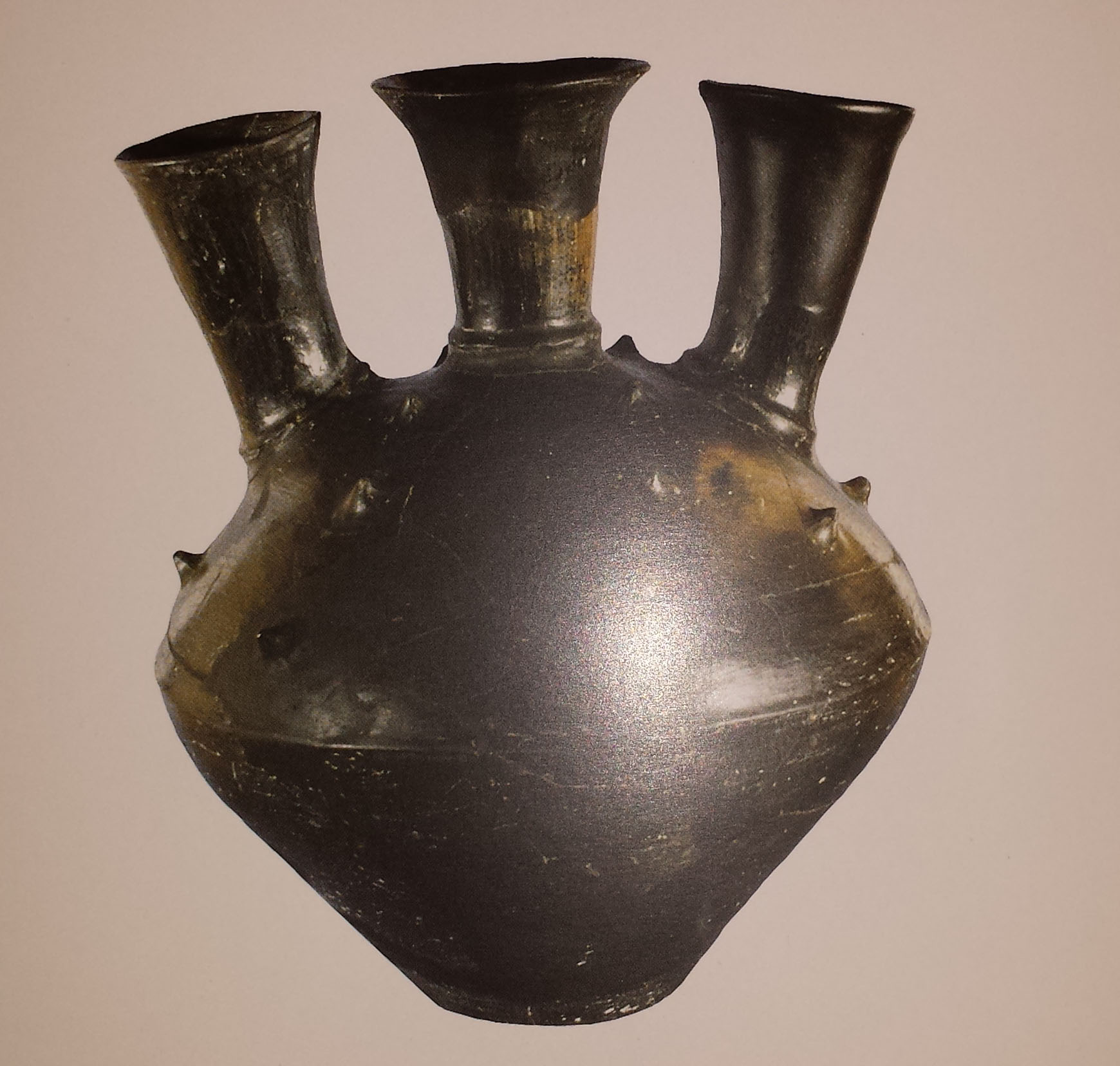 Woman shaped pitcher. Image taken from A Glance from the Bronze Age - Yerevan, History Museum of Armenia, 2016, page 70.