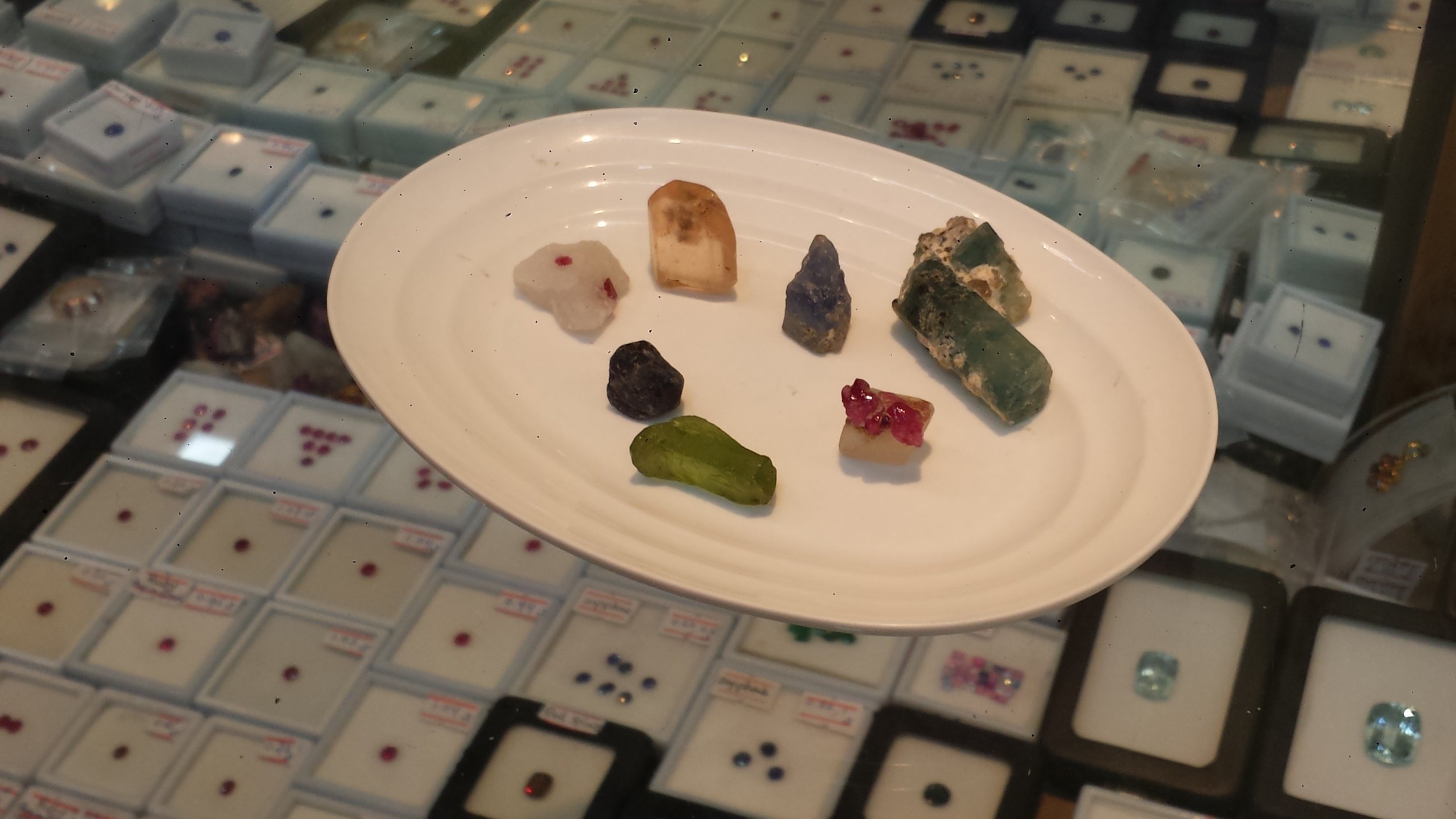 Left to right: spinal, topaz, sapphire, peridot, sapphire, aquamarine, and ruby