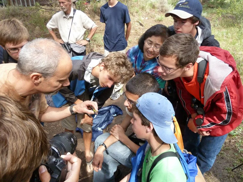 Scott teaches kids at the Estes Park YMCA the biology of a hummingbird before banding it