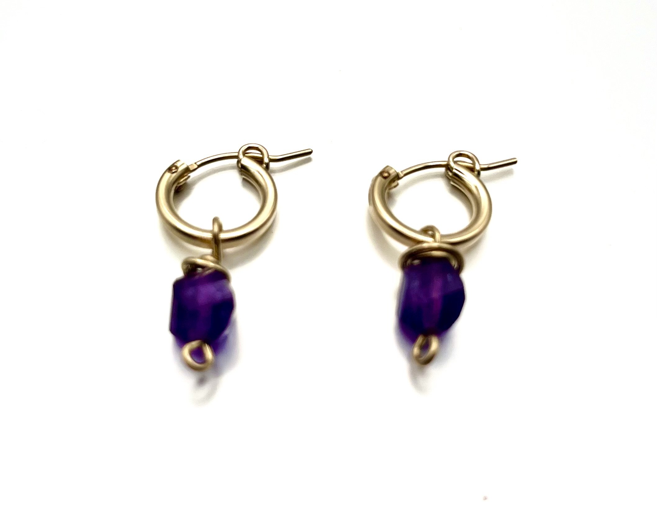 11.5mm gf huggie with faceted amethyst drops.jpeg