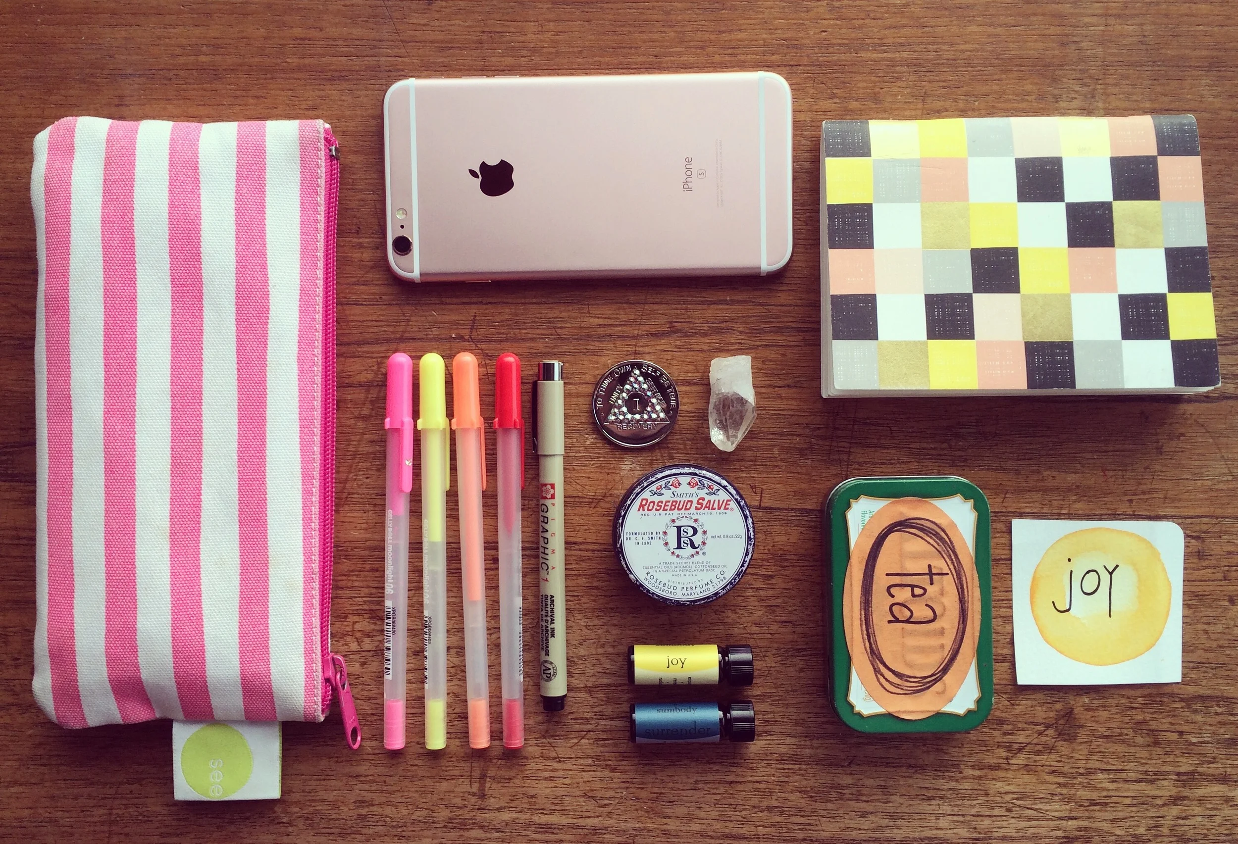 My Sobriety Toolbox :: pens, phone, 1 year sobriety chip, crystal, lip balm, essential oils, tea bags, mantra card + notebook