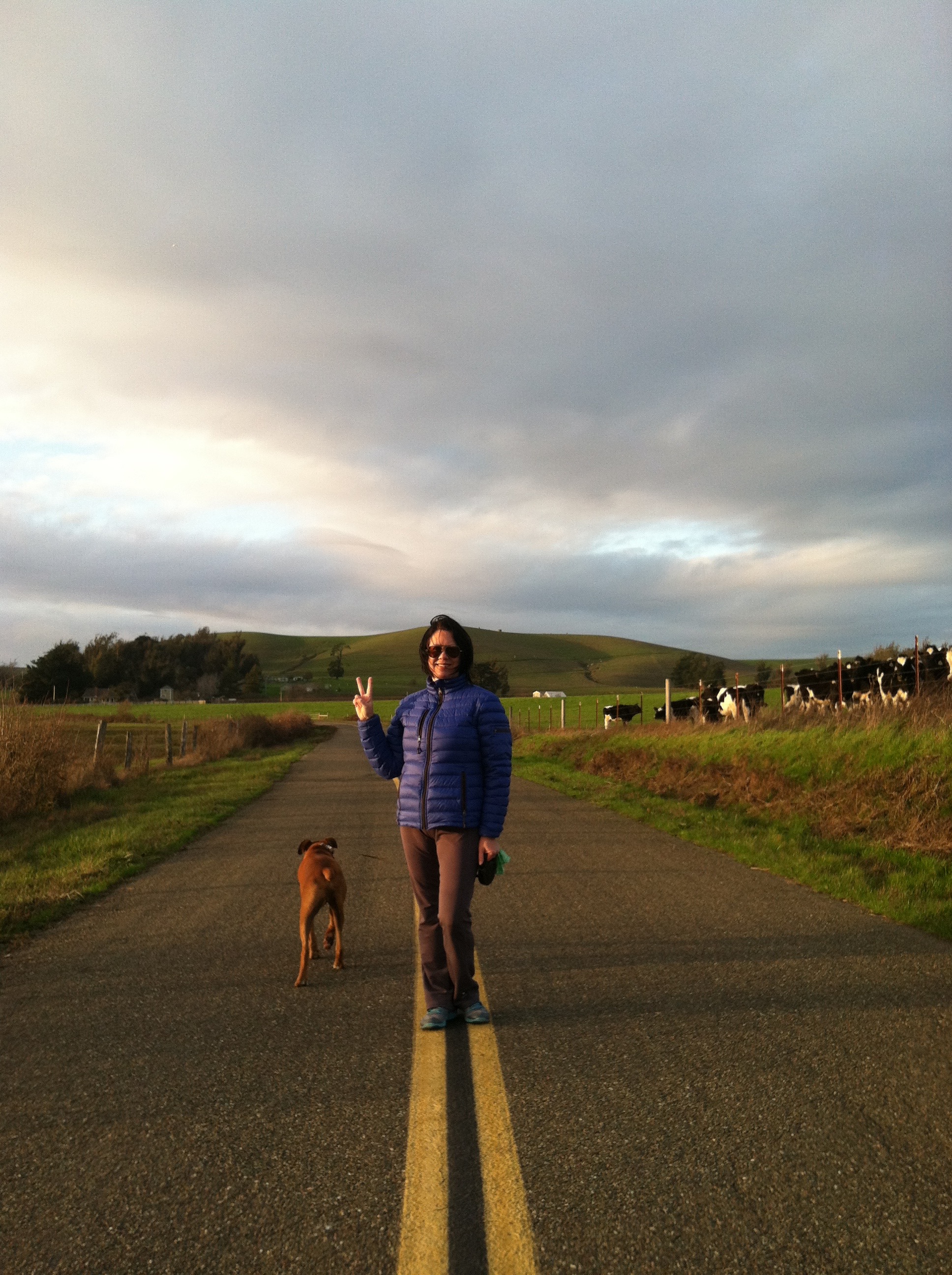My home is on the hillside behind me - to the left of my peace sign.