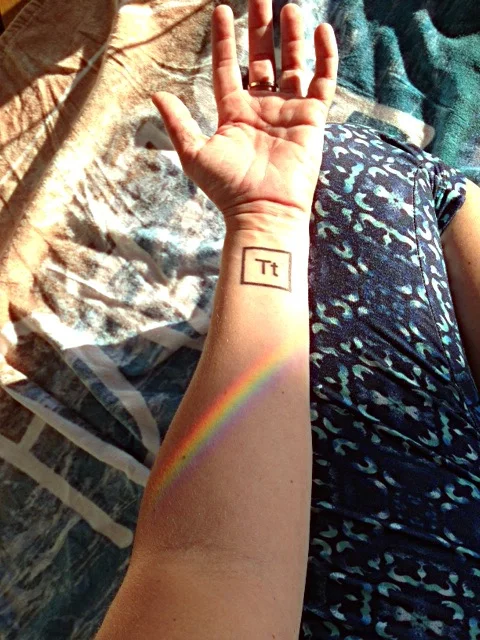 Sara's own prism + ray of light showing off her new teetotaler tattoo